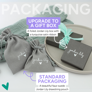 a package of gift boxes with a tag on it